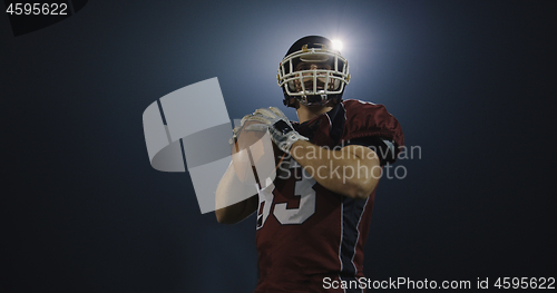 Image of american football player throwing rugby ball