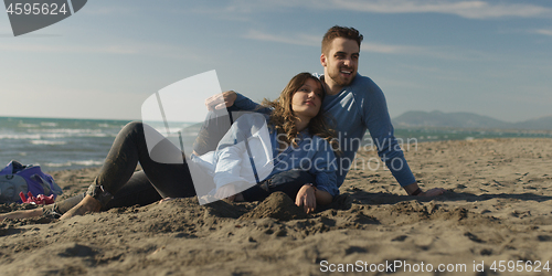 Image of Couple enjoying time together at beach