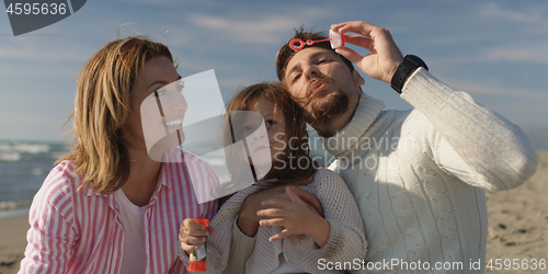 Image of Young family enjoying vecation during autumn