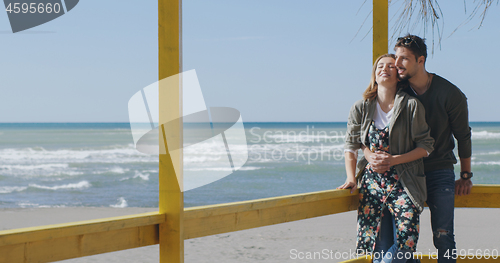 Image of Couple chating and having fun at beach bar