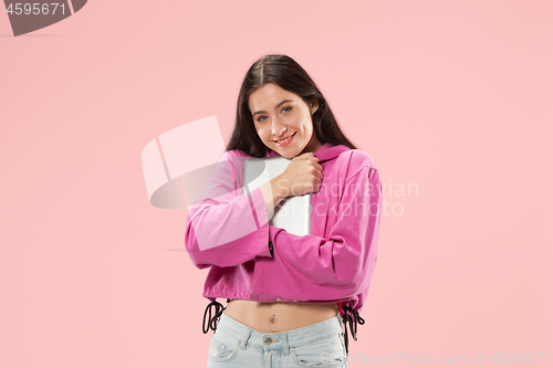Image of Businesswoman hugging laptop. Love to computer concept.