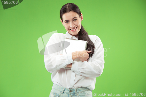 Image of Businesswoman hugging laptop. Love to computer concept.