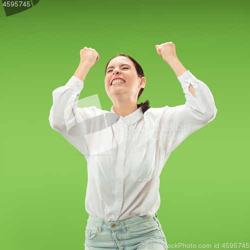 Image of Winning success woman happy ecstatic celebrating being a winner. Dynamic energetic image of female model