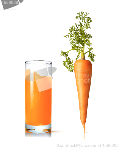 Image of Juice glass with fresh organic carrot vegetable.