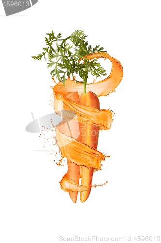 Image of Cut natural organic carrot with splashes.