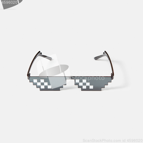 Image of Art pixel glasses for protection from harmful rays.