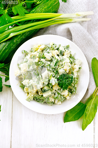 Image of Salad with potatoes and sorrel on wooden board top