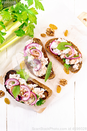 Image of Bruschetta with fish and curd on white board top