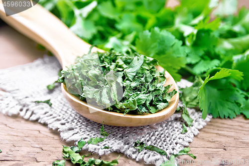 Image of Cilantro dried in spoon on board