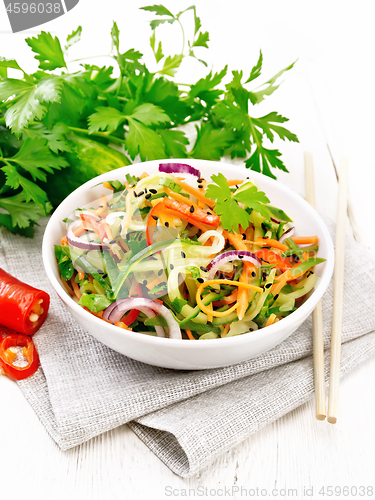 Image of Salad of cucumber in bowl on white board