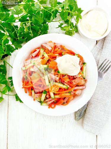 Image of Salad of sausage and spicy carrots on light board top