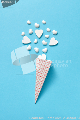 Image of Valentine\'s card with paper cone of white plaster hearts.