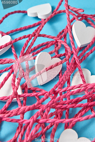 Image of Close-up background from red rope and white hearts.