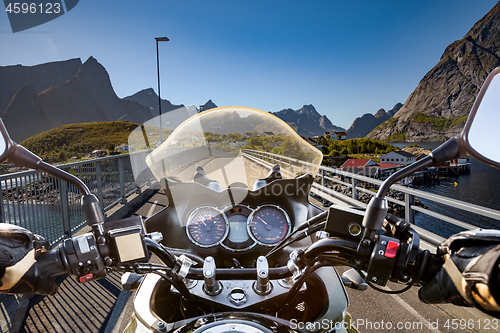 Image of Biker rides on road in Norway. First-person view.