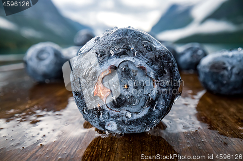 Image of Blueberry antioxidants on a wooden table on a background of Norw