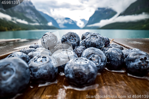 Image of Blueberry antioxidants on a wooden table on a background of Norw