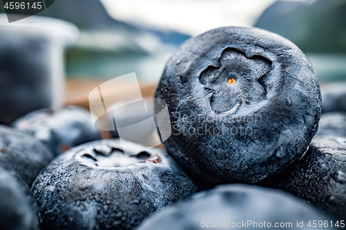 Image of Blueberry antioxidants on a wooden table on a background of Norw