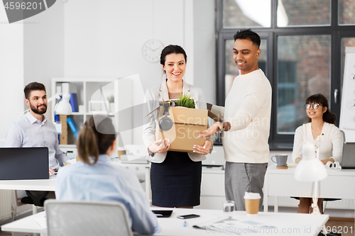 Image of new female employee meeting colleagues at office