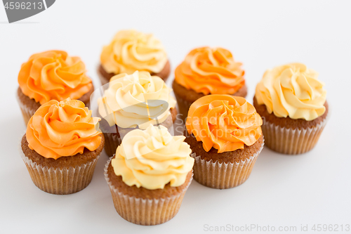 Image of cupcakes with frosting on white background
