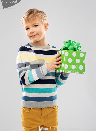 Image of smiling boy with birthday gift box