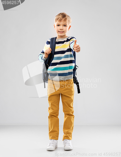 Image of student boy with school bag showing thumbs up