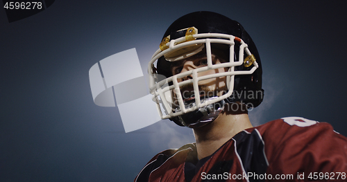 Image of portrait of young confident American football player