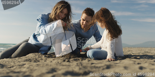 Image of Young family enjoying vecation during autumn