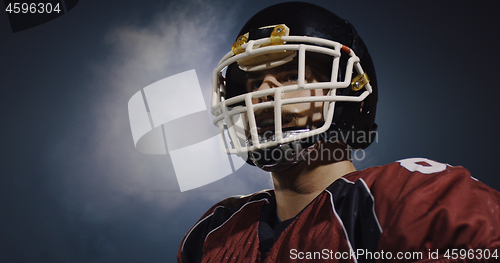 Image of portrait of young confident American football player