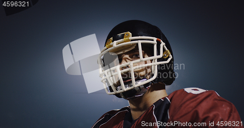 Image of portrait of young confident American football player