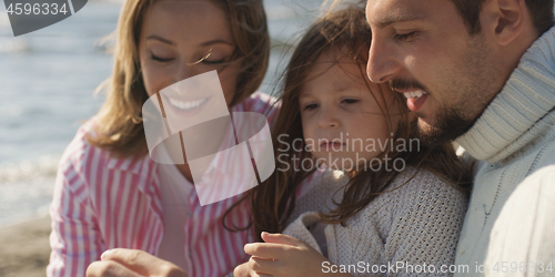 Image of Young family enjoying vecation during autumn