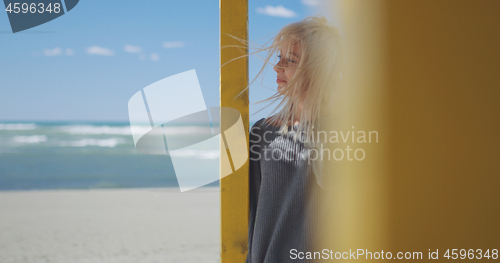 Image of Young woman enjoying the warm autumn day