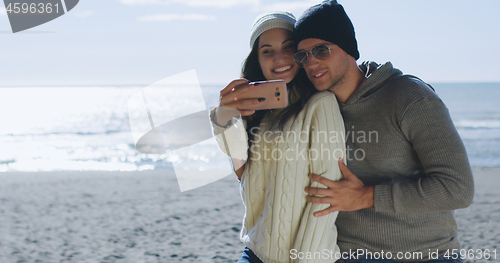 Image of Gorgeous couple taking picture of herselfe