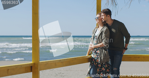 Image of Couple chating and having fun at beach bar