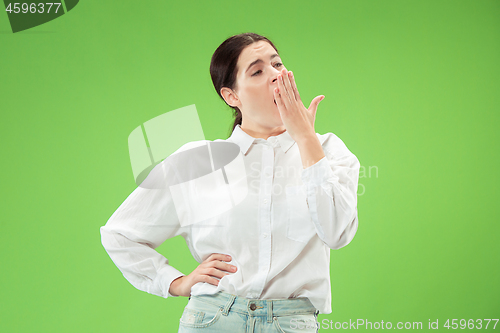 Image of Beautiful bored woman bored isolated on green background