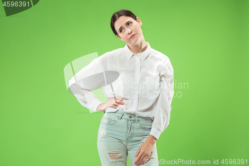 Image of Beautiful bored woman bored isolated on green background