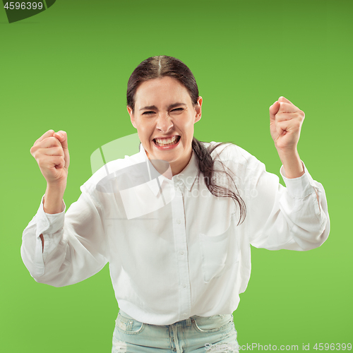 Image of Winning success woman happy ecstatic celebrating being a winner. Dynamic energetic image of female model