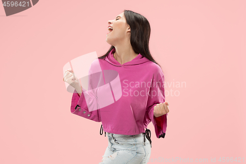 Image of Winning success woman happy ecstatic celebrating being a winner. Dynamic energetic image of female model