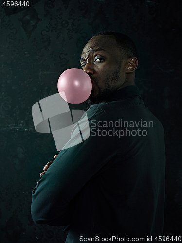 Image of The african american man with bubble gum