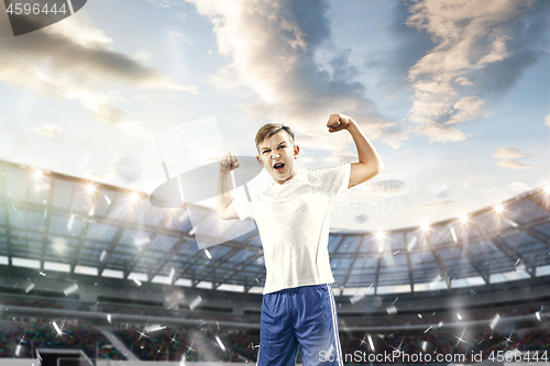 Image of Young boy as winner at stadium