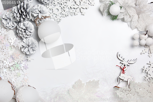 Image of Christmas decorative composition of toys on a white background surrealism. Top view