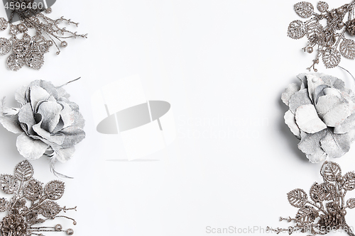 Image of Christmas decorative composition of toys on a white background surrealism. Top view