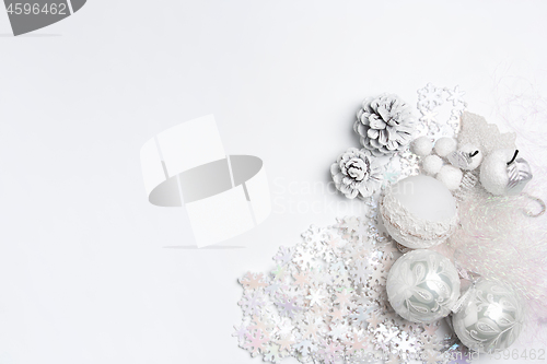 Image of Christmas decorative composition of toys on a white background surrealism. Top view