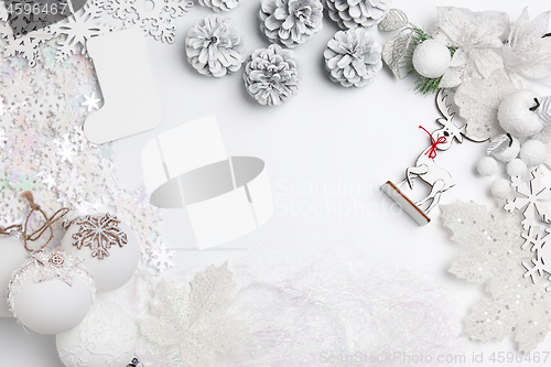 Image of Christmas decorative composition of toys on a white background surrealism. Top view