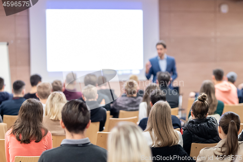 Image of Business speaker giving a talk at business conference event.