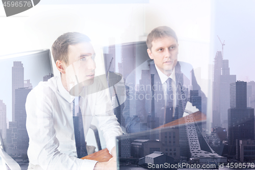 Image of Business team analyzing data at business meeting in corporate office in new york city.