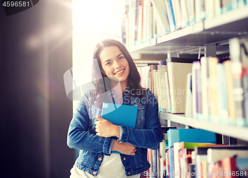 Image of high school student girl reading book at library