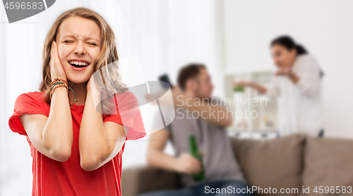 Image of stressed girl over her parents having fight