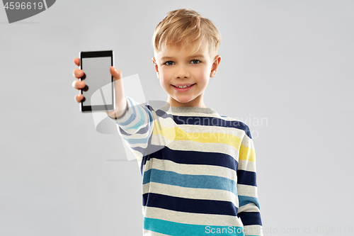 Image of smiling boy showing blank screen of smartphone