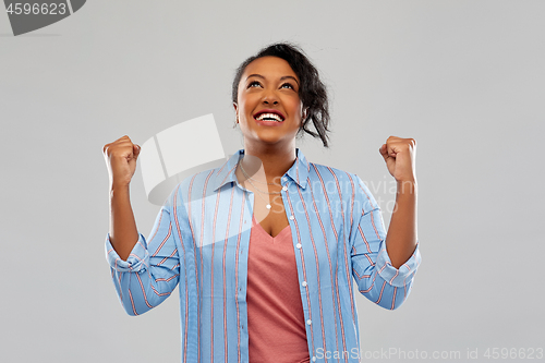 Image of happy african american woman celebrating success