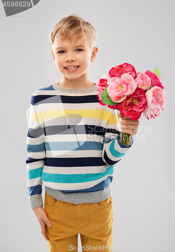 Image of smiling boy with bunch of peony flowers